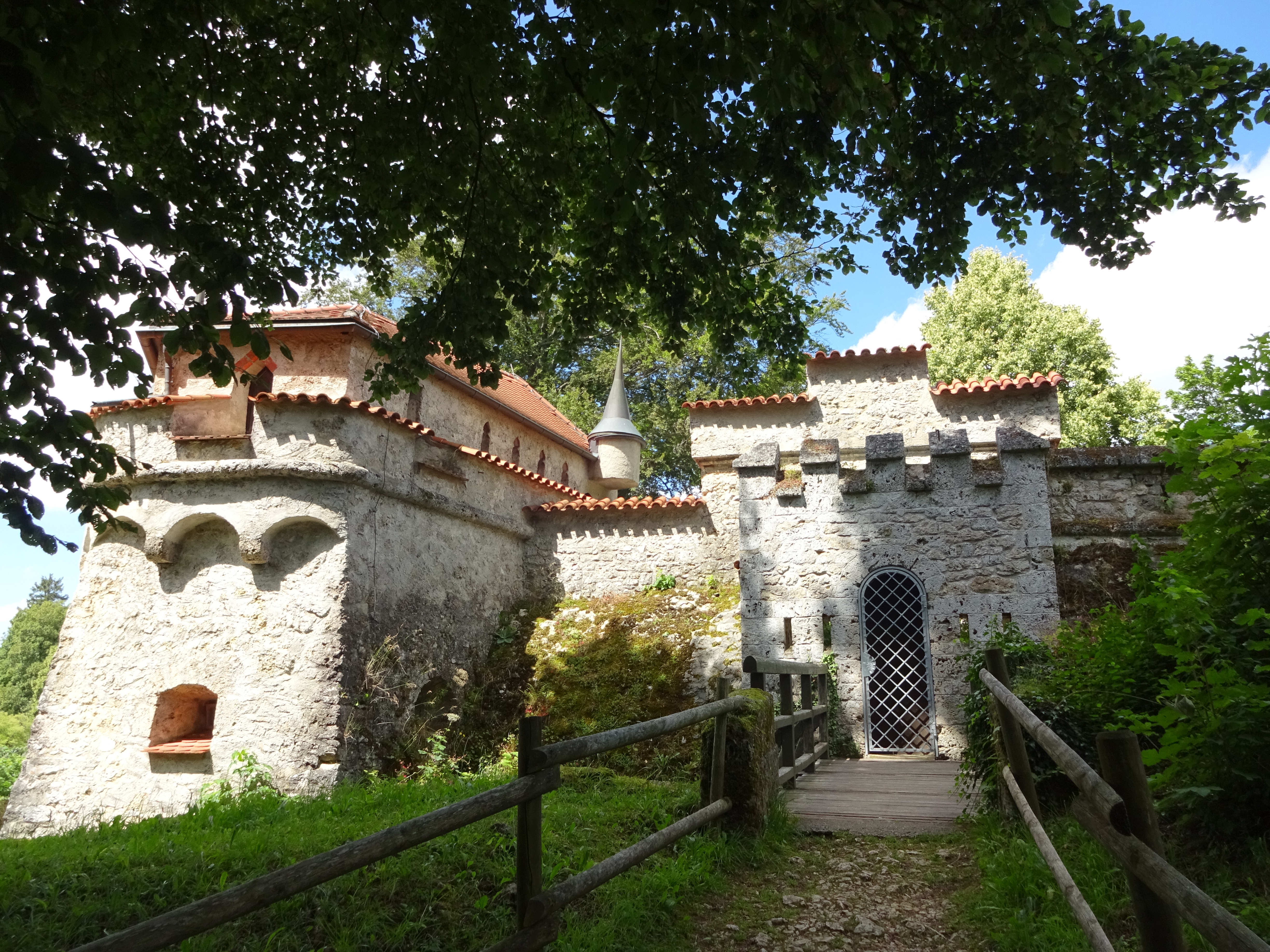 Historic European architecture framed by trees