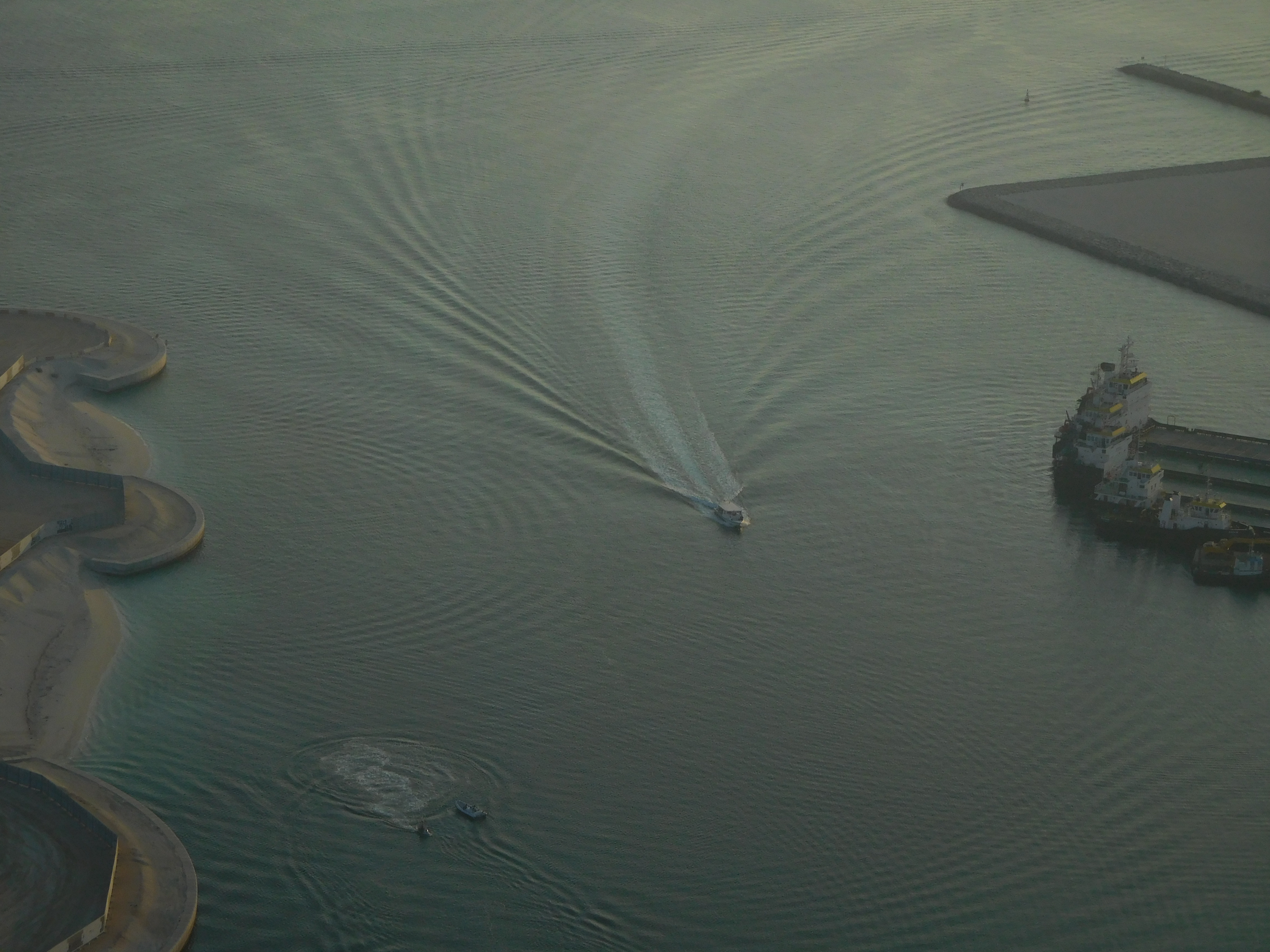 A cinematic view of coastal water and architectural infrastructure